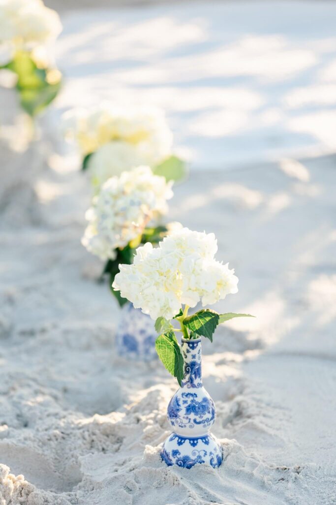 flowers in the sand for surprise proposal by naples photographer