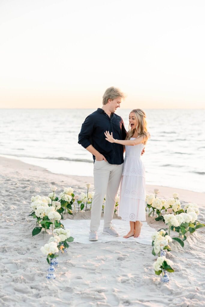 man and woman just got engaged by naples photographers