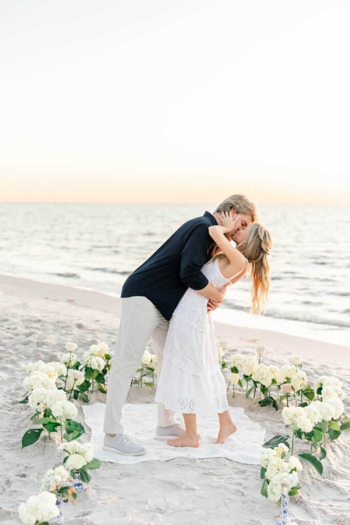 recently engaged couple beach proposal by photographers naples fl