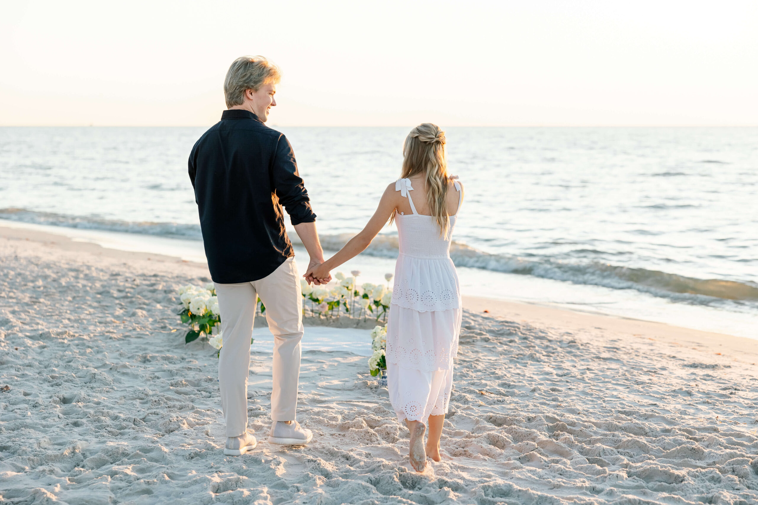 couple walking toward naples florida photographer for proposal