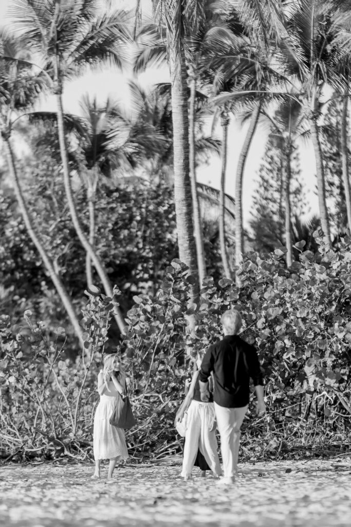 couple embracing at surprise naples proposal on beach