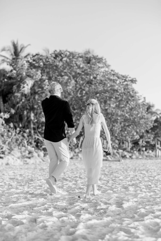 couple walking toward naples florida photographer for proposal