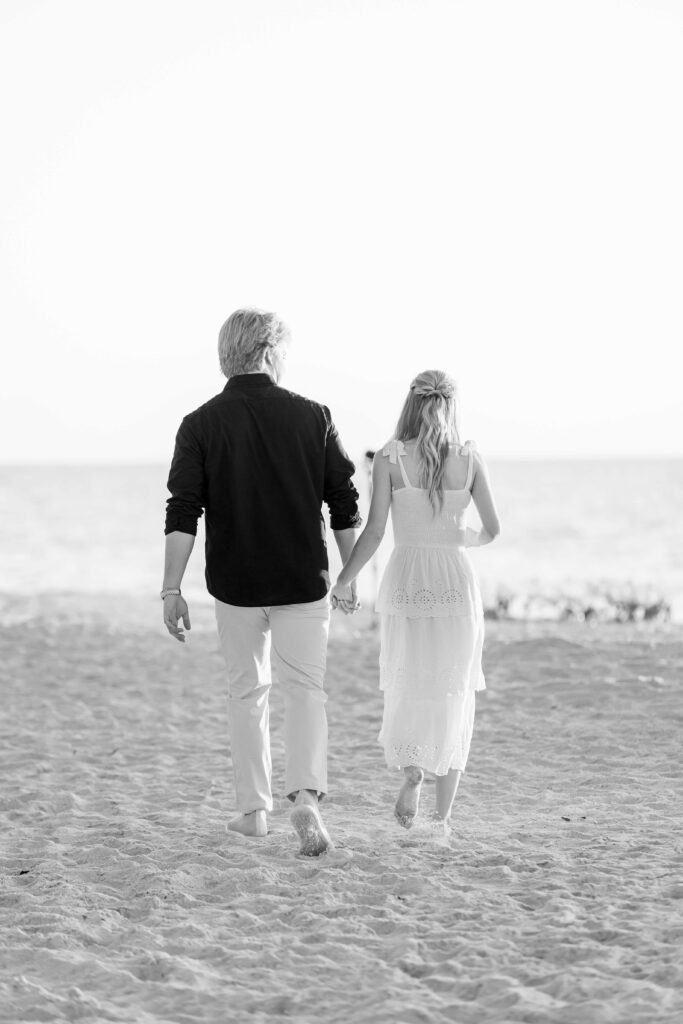 couple walking toward naples florida photographer for proposal