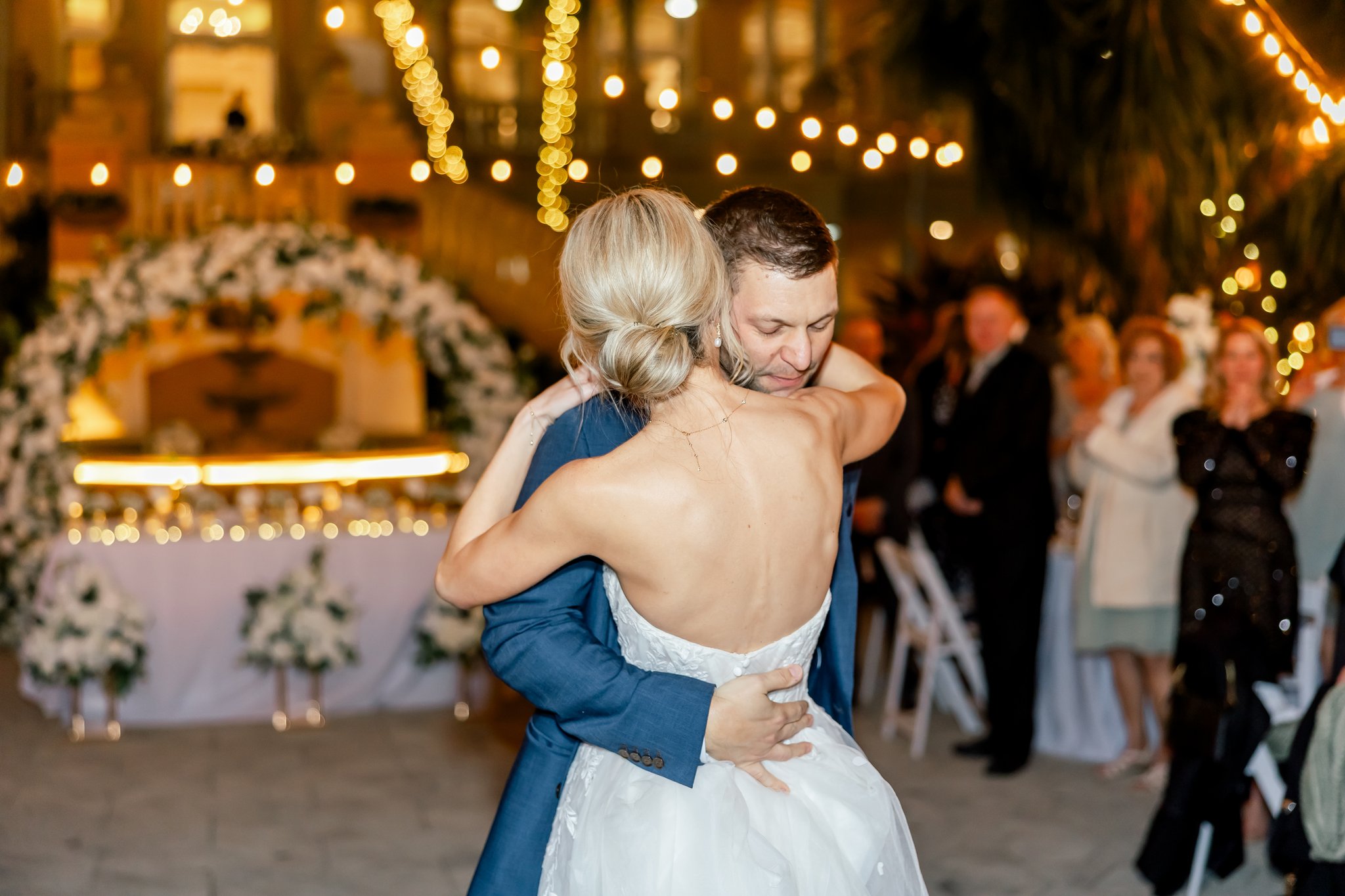 bride and groom first dance at the club at the strand wedding venue