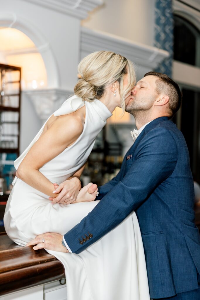 bride and groom kissing at the club at the strand naples fl