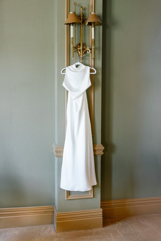 wedding dress hanging at the club at the strand photos