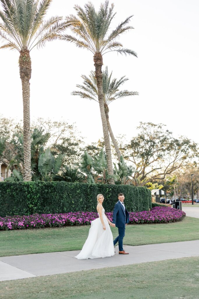 bride and groom at the club at the strand wedding venue