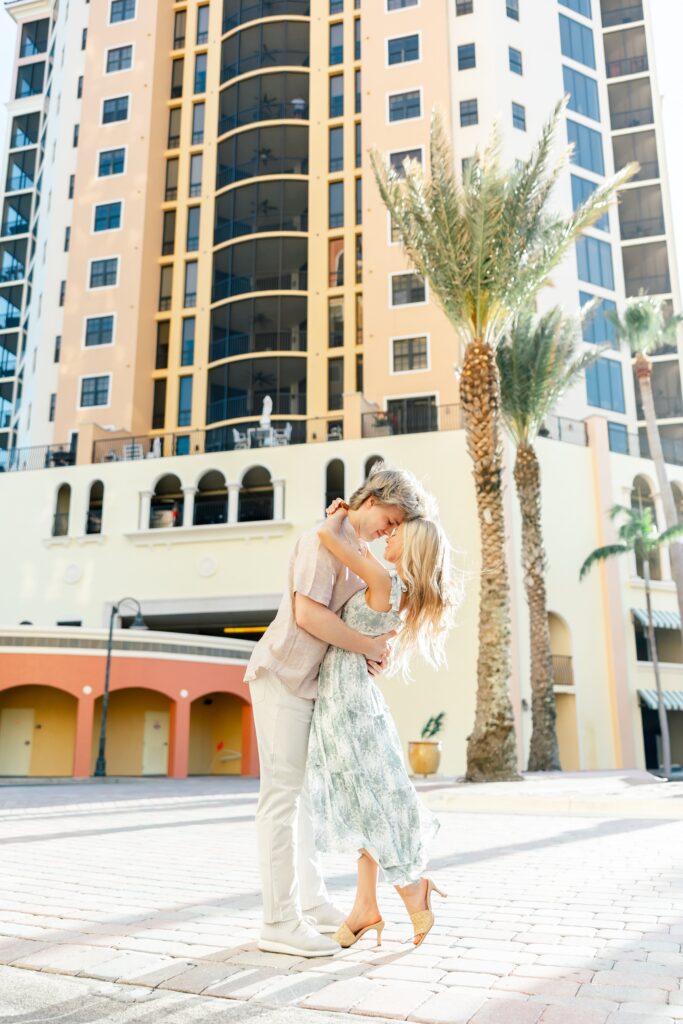 couple embracing at cape harbour marina cape coral fl