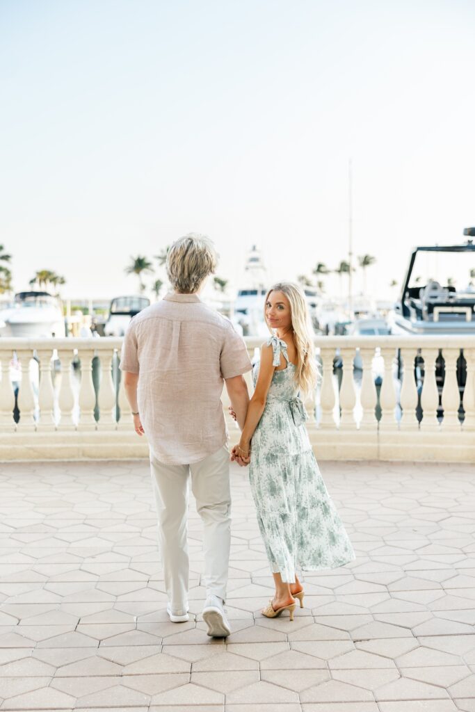 couple walking together for engagement photos at cape harbour