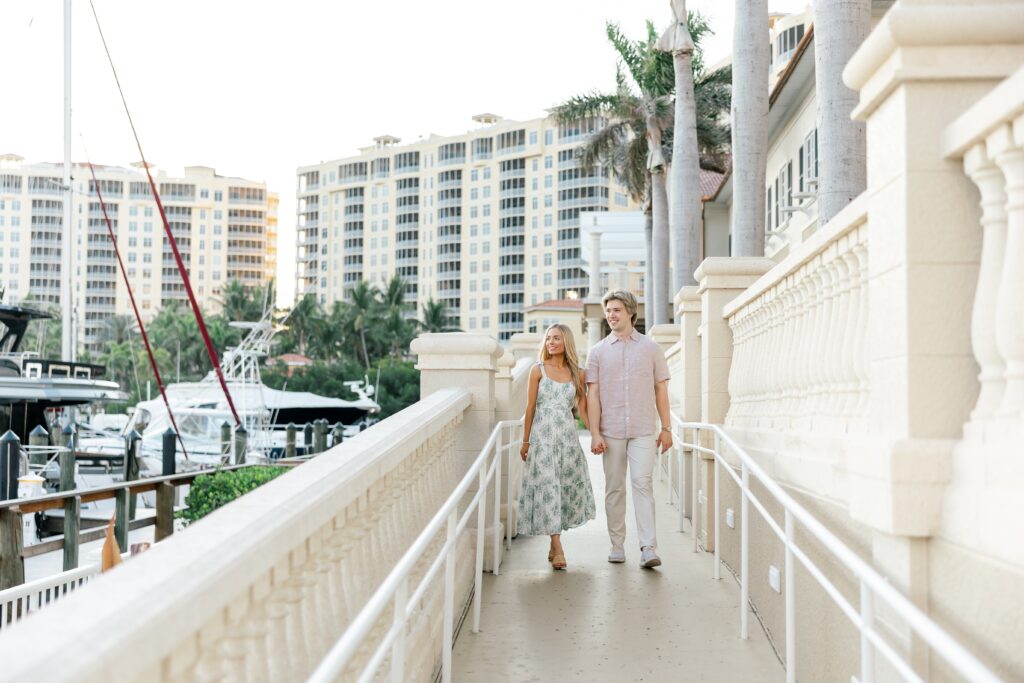 couple walking down path at cape harbour cape coral