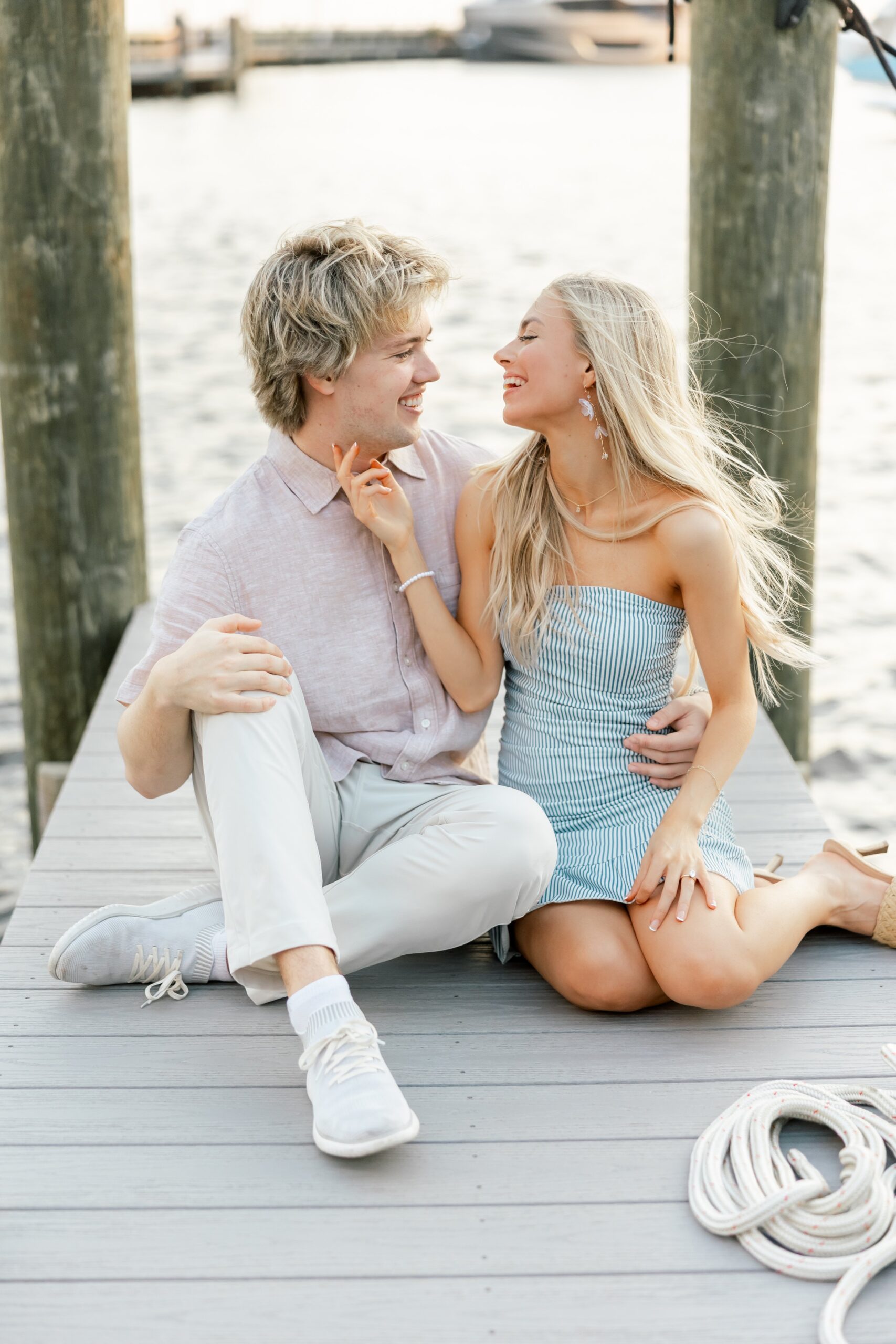 couple laughing at each other on dock at cape harbour cape coral fl