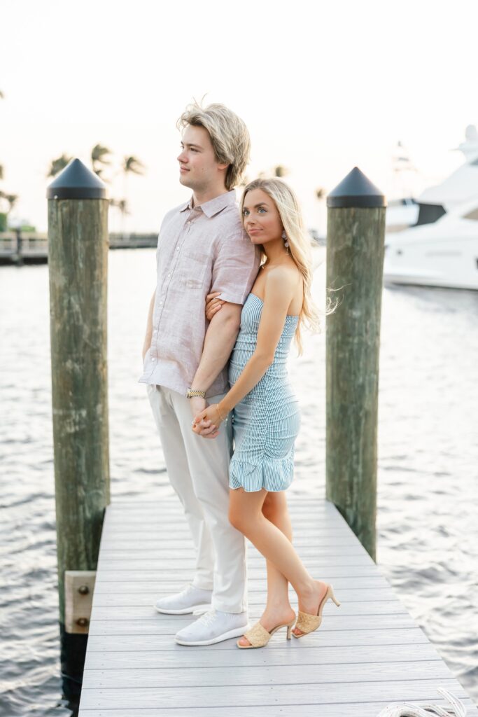 couple on dock at cape harbour marina cape coral fl