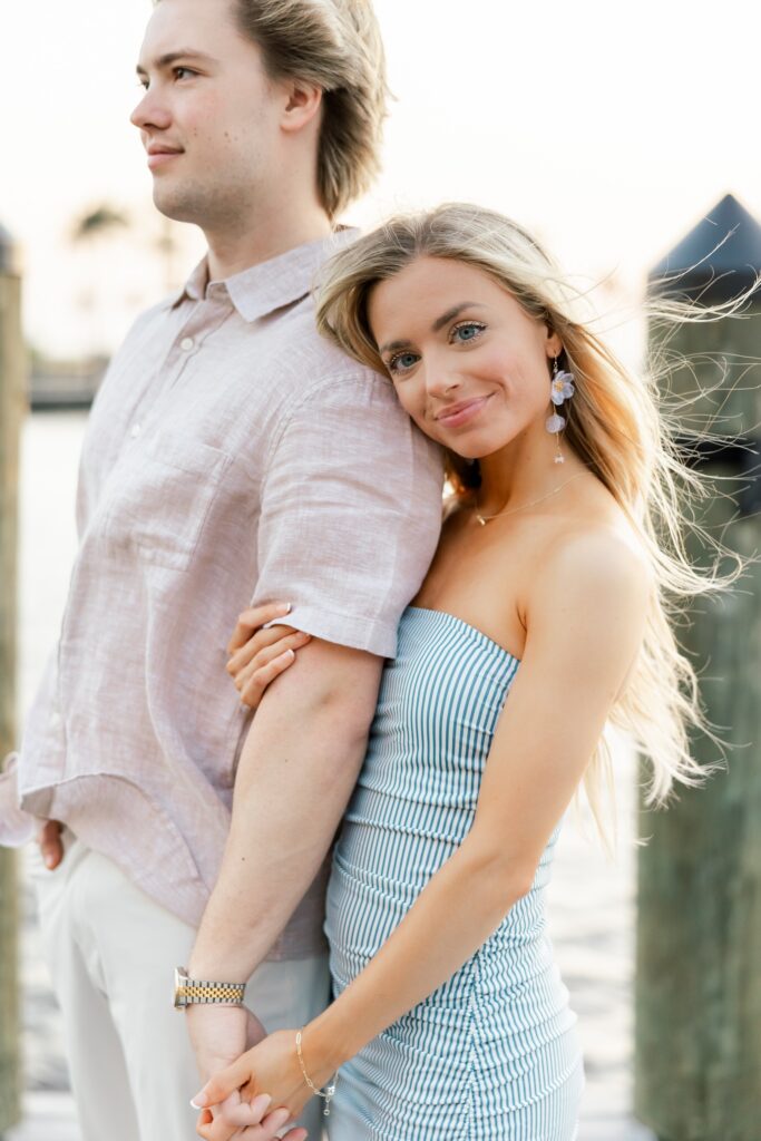 couple posing for engagement photos at cape harbour marina cape coral fl
